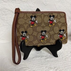Disney X Coach Corner Zip
Wristlet In Signature Jacquard With Mickey Mouse Print